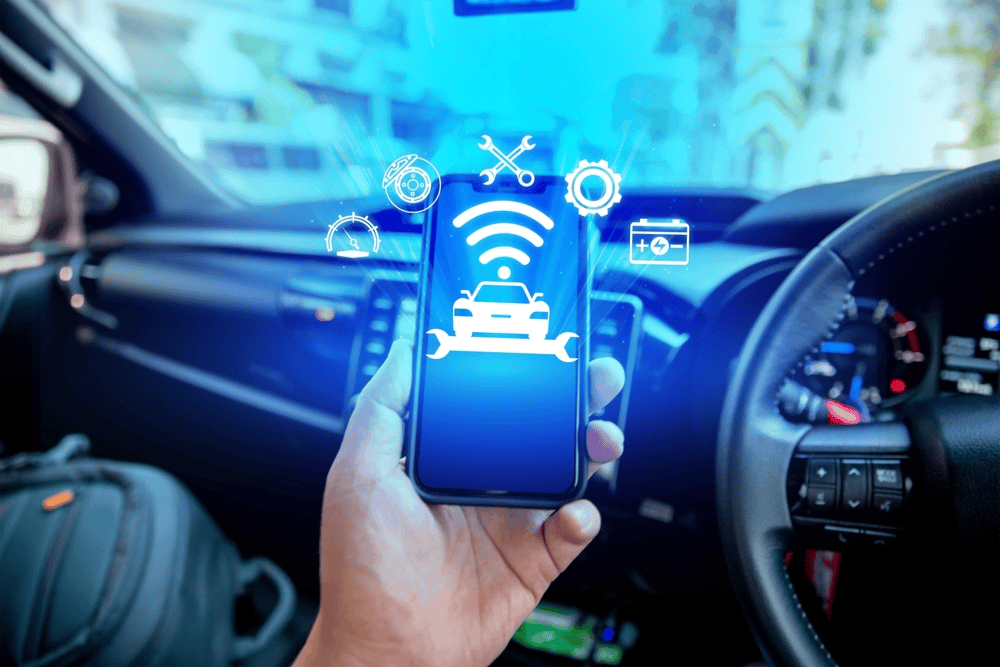 A man is holding his phone and integrated it to his vehicle